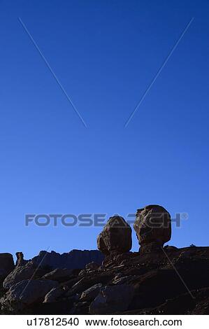 Stock Image - Rock formations in shadow in Capitol Reef National Park, USA. Fotosearch