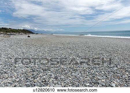 Rocky beach in Haast, New Zealand View Large Photo Image Stock Image - Rocky beach in Haast, New Zealand. Fotosearch