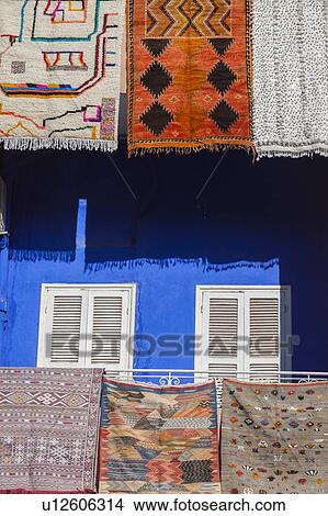 Picture - Rugs hanging from balconies in Marrakesh, Morocco. Fotosearch