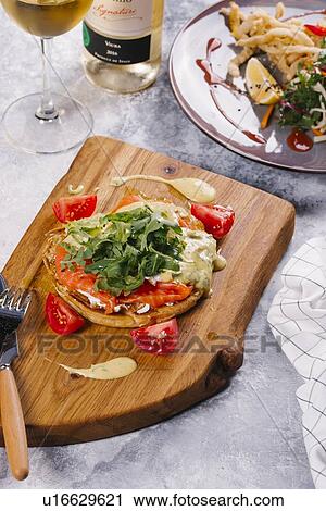 Salmon on bread with arugula View Large Photo Image Stock Image - Salmon on bread with arugula. Fotosearch