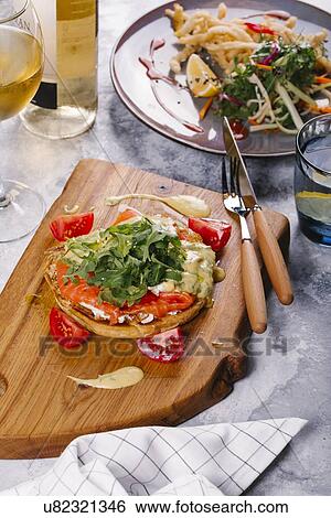 Salmon on bread with arugula View Large Photo Image Stock Photograph - Salmon on bread with arugula. Fotosearch
