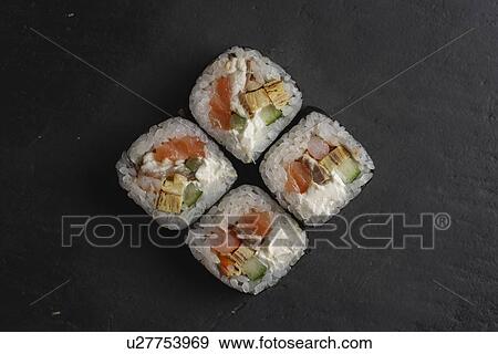 Salmon sushi on black surface View Large Photo Image Stock Photo - Salmon sushi on black surface. Fotosearch