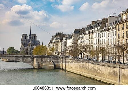 Stock Image - Scenic waterfront view of Notre Dame Cathedral, Paris, France. Fotosearch