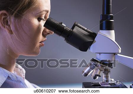 Scientist using microscope. View Large Photo Image Stock Photo - Scientist using microscope.. Fotosearch