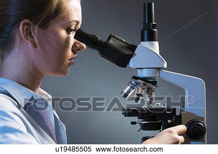 Scientist using microscope. View Large Photo Image Stock Photography - Scientist using microscope.. Fotosearch
