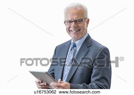 Stock Image - Senior man with digital tablet.. Fotosearch