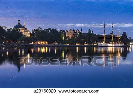 Stock Image - Ship on river at sunset in Stockholm, Sweden. Fotosearch
