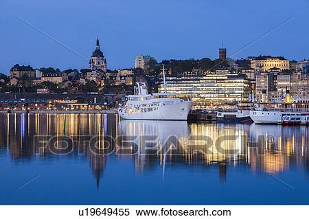 Stock Photography - Ship on river at sunset in Stockholm, Sweden. Fotosearch