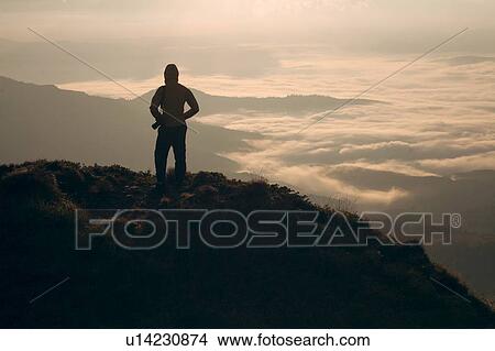 Silhouette of man in the Carpathian Mountain Range at sunrise View Large Photo Image Picture - Silhouette of man in the Carpathian Mountain Range at sunrise. Fotosearch