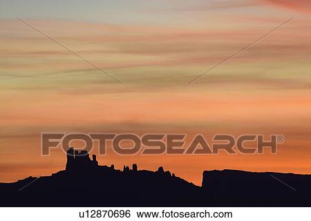 Stock Photograph - Silhouette of rock formations in Professor Valley in Arches National Park, Utah. Fotosearch