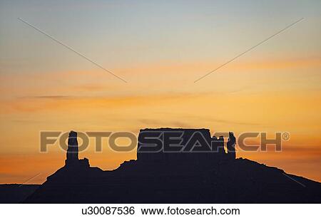 Stock Photograph - Silhouette of rock formations in Professor Valley in Arches National Park, Utah. Fotosearch