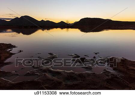 Silhouetted mountain ranges on horizon over water, Cape Town, Western Cape, South Africa View Large Photo Image Stock Photo - Silhouetted mountain ranges on horizon over water, Cape Town, Western Cape, South Africa. Fotosearch