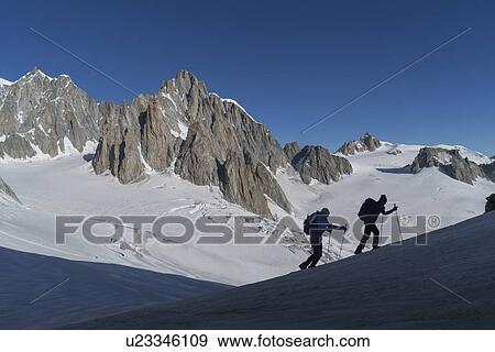 Silhouettes of hikers on Mer de Glace in Mont Blanc massif, France View Large Photo Image Stock Photo - Silhouettes of hikers on Mer de Glace in Mont Blanc massif, France. Fotosearch
