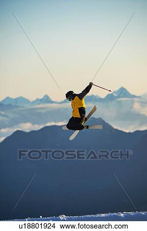 Picture - Skier in midair, Saas-Fee, Valais, Switzerland. Fotosearch
