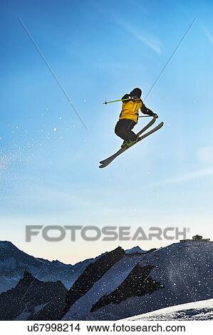 Skier in midair, Saas-Fee, Valais, Switzerland View Large Photo Image Picture - Skier in midair, Saas-Fee, Valais, Switzerland. Fotosearch