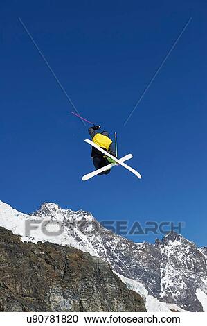 Skier in midair, Saas-Fee, Valais, Switzerland View Large Photo Image Stock Image - Skier in midair, Saas-Fee, Valais, Switzerland. Fotosearch