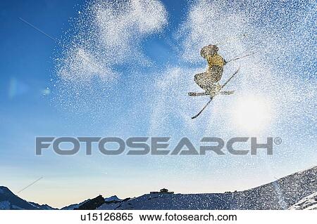 Stock Photography - Skier in midair, Saas-Fee, Valais, Switzerland. Fotosearch