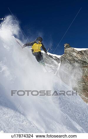 Picture - Skier moving down slopes, Saas-Fee, Valais, Switzerland. Fotosearch