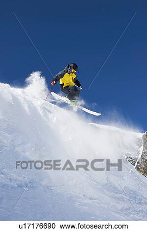 Stock Image - Skier moving down slopes, Saas-Fee, Valais, Switzerland. Fotosearch