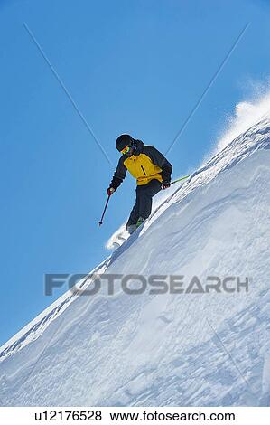 Skier moving down slopes, Saas-Fee, Valais, Switzerland View Large Photo Image Stock Photo - Skier moving down slopes, Saas-Fee, Valais, Switzerland. Fotosearch