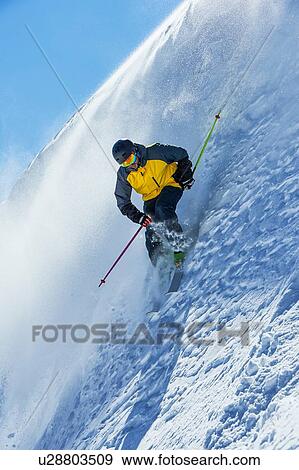 Skier moving down slopes, Saas-Fee, Valais, Switzerland View Large Photo Image Stock Photo - Skier moving down slopes, Saas-Fee, Valais, Switzerland. Fotosearch