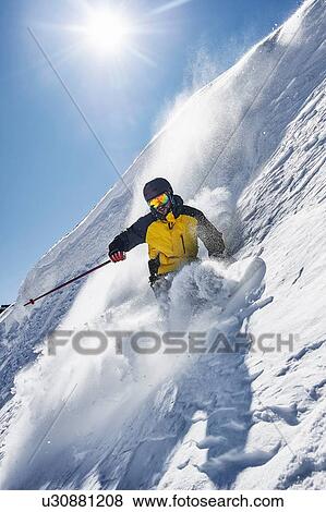 Skier moving down slopes, Saas-Fee, Valais, Switzerland View Large Photo Image Stock Photo - Skier moving down slopes, Saas-Fee, Valais, Switzerland. Fotosearch