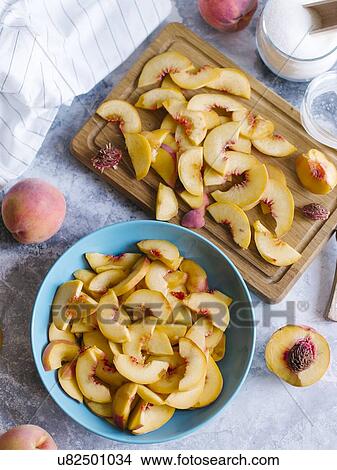 Picture - Sliced peaches. Fotosearch