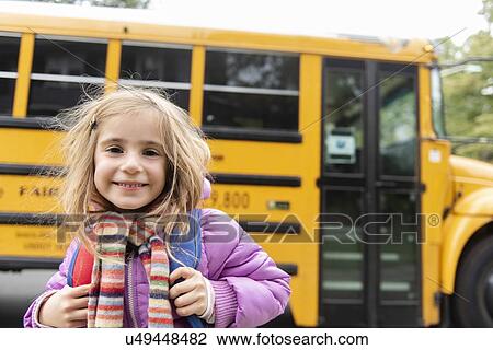 Smiling girl by school bus View Large Photo Image Stock Image - Smiling girl by school bus. Fotosearch