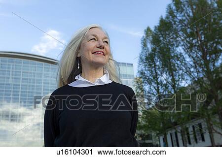 Stock Image - Smiling mature woman in Washington DC. Fotosearch
