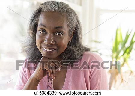 Stock Photo - Smiling mature woman. Fotosearch