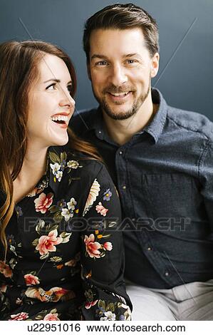 Stock Photograph - Smiling mid adult couple. Fotosearch