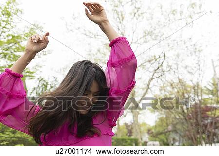 Smiling woman dancing View Large Photo Image Picture - Smiling woman dancing. Fotosearch