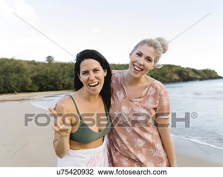 Smiling women on beach View Large Photo Image Stock Image - Smiling women on beach. Fotosearch