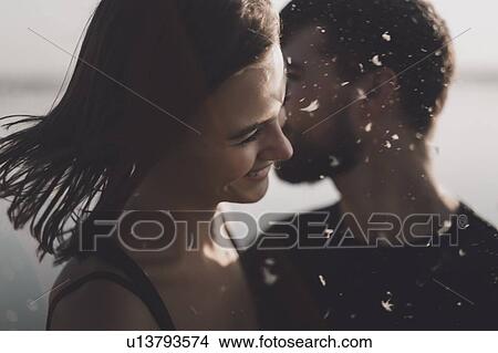 Smiling young couple with pollen View Large Photo Image Picture - Smiling young couple with pollen. Fotosearch