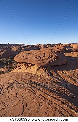 Stock Image - Smooth rock formations in Monument Valley, Arizona, USA. Fotosearch