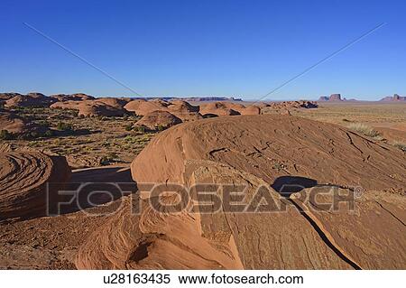 Smooth rock formations in Monument Valley, Arizona, USA View Large Photo Image Stock Photography - Smooth rock formations in Monument Valley, Arizona, USA. Fotosearch