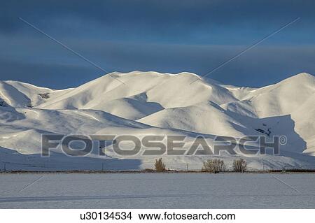 Picture - Snow capped mountain in Picabo, Idaho. Fotosearch