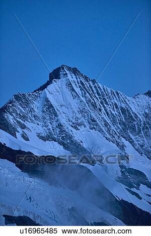 Snow capped mountain ridge, Saas-Fee, Valais, Switzerland View Large Photo Image Stock Photography - Snow capped mountain ridge, Saas-Fee, Valais, Switzerland. Fotosearch