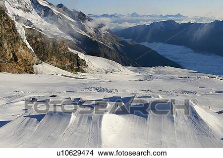 Snow landscape at bottom of mountain range, Saas-Fee, Valais, Switzerland View Large Photo Image Picture - Snow landscape at bottom of mountain range, Saas-Fee, Valais, Switzerland. Fotosearch