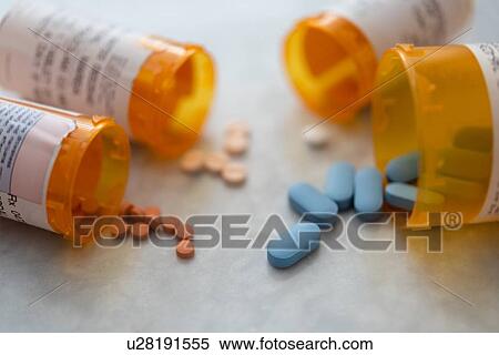 Stock Photography - Spilled pill bottles. Fotosearch