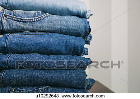 Stock Photo - Stack of folded jeans. Fotosearch