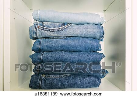 Stock Photo - Stack of folded jeans. Fotosearch