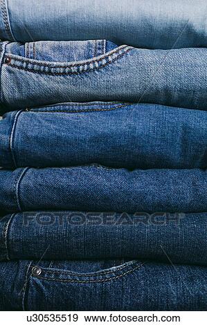Stock Photo - Stack of folded jeans. Fotosearch