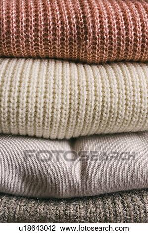 Stack of folded sweaters View Large Photo Image Stock Image - Stack of folded sweaters. Fotosearch