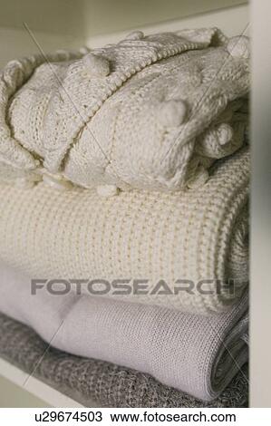Stock Image - Stack of folded sweaters. Fotosearch