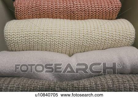 Stock Photography - Stack of folded sweaters. Fotosearch