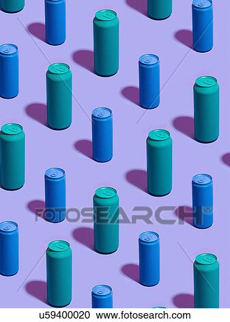 Stock Image - Still life of turquoise and blue drink cans in diagonal rows on purple background. Fotosearch