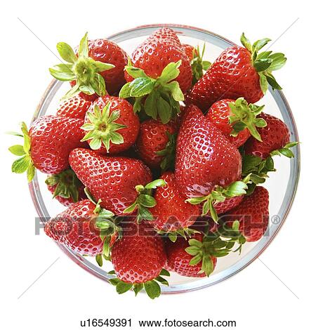 Stock Image - Strawberries in bowl, studio shot.. Fotosearch