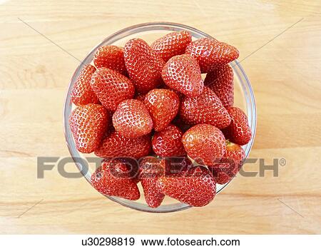 Stock Photo - Strawberries in bowl, studio shot.. Fotosearch