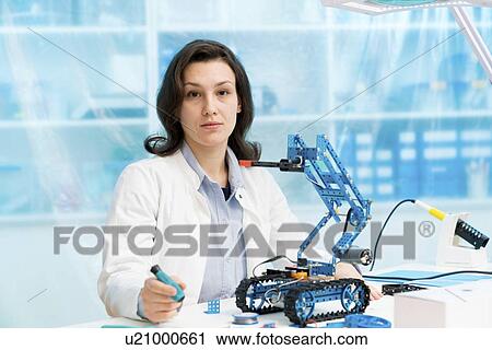 Student in CNC (computer numerical control) and robotics laboratory, experiment with microcontroller and robot CNC module. View Large Photo Image Stock Image - Student in CNC (computer numerical control) and robotics laboratory, experiment with microcontroller and robot CNC module.. Fotosearch